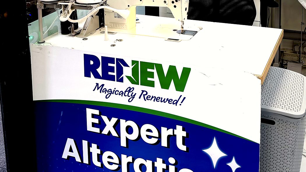 The alterations corner of the shop, machines set up and in use